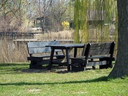 wooden table and benches for relaxing by the lake