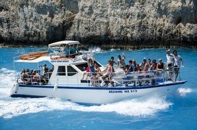 Tourists on a pleasure boat off the coast of Zante in Greece