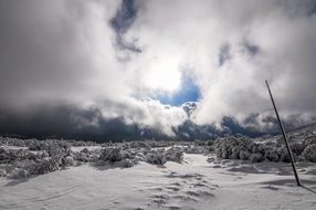 cloudy sky over winter snowy landscape