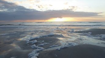 Beach with waves during sunset in St. Petersburg