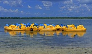 Yellow and blue boats in the water