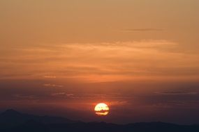 orange sunset in the clouds over spain