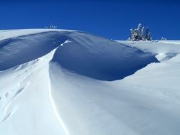 snow on a slope on a sunny day