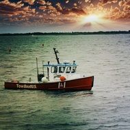 ship on water during sunset