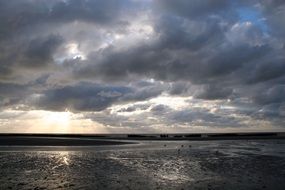 cloudy grey sky in the evening on the beach