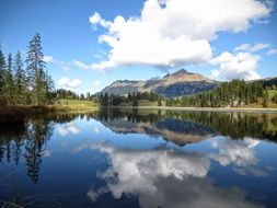 white clouds reflected in the lake