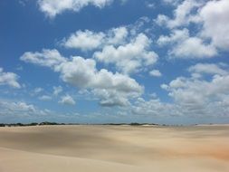 cloudy sky over sand dunes