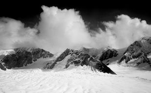 clouds in the mountains at denali national park in alaska