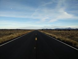 endless highway along fields in California