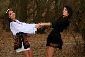 girls dancing in the forest