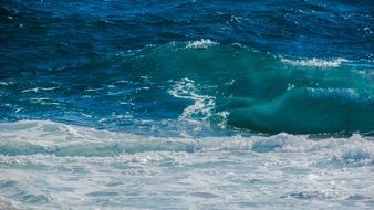 azure ocean waves with white foam