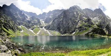 Black pond under scratches and Tatry in Poland