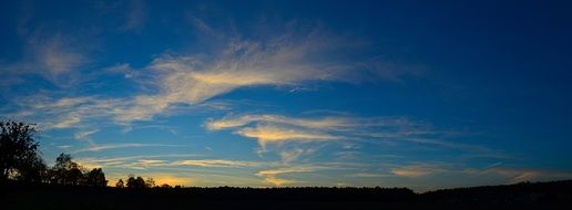 panoramic view of evening sky over the field at dusk