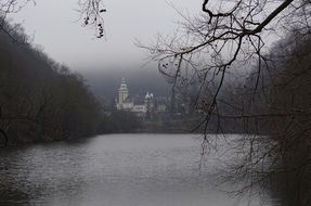 landscape of castle by the mountain lake