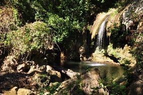 waterfall in forest at summer, france