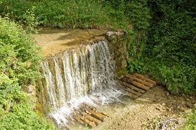 panorama of cascading waterfall in the forest of upper bavaria