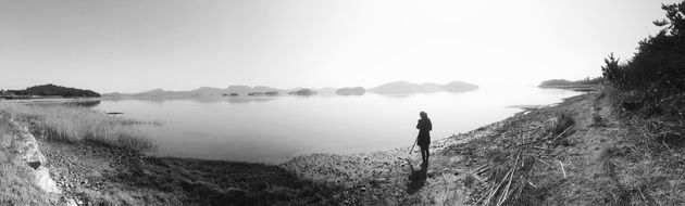 panoramic view of the lake with a girl on the shore