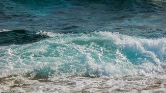 foaming ocean waves on the beach