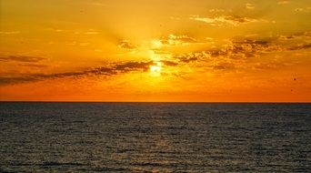 yellow sunset on the sea horizon