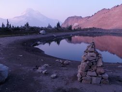 calm water in the lake near the mountain