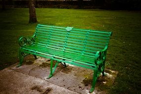 green metal park bench