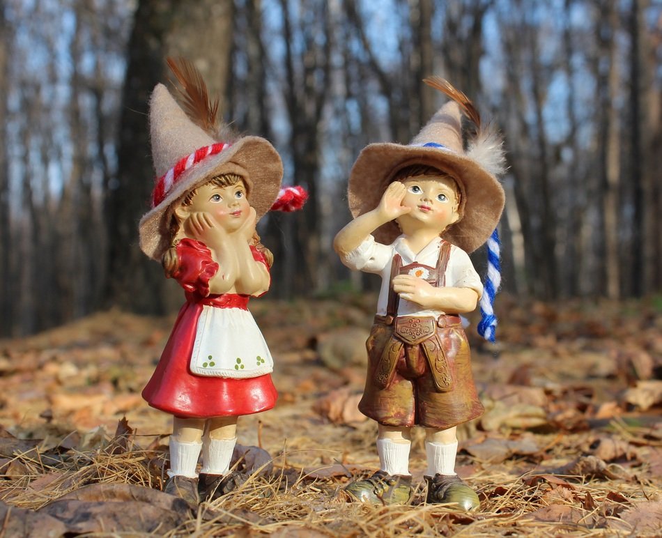 figures of children in the autumn forest