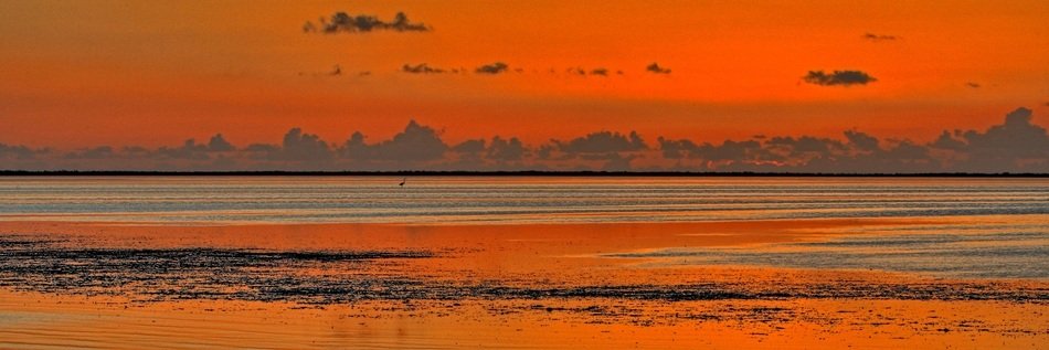 orange sunset over the water in Florida