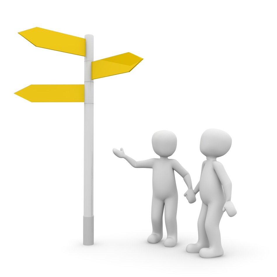 two figures near the post with directions