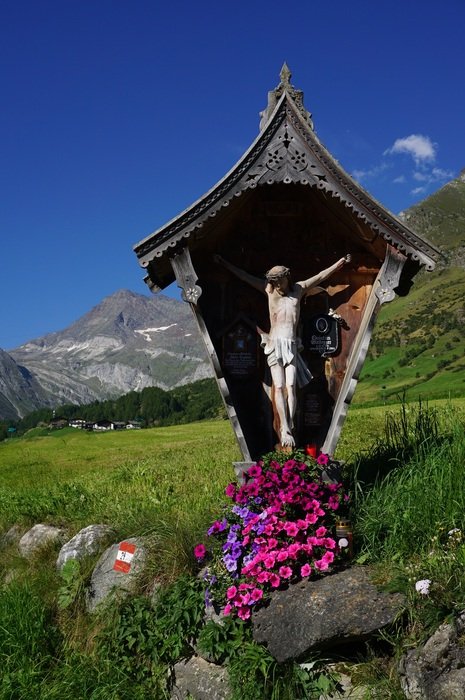 cross with a crucifix on the path of Merano