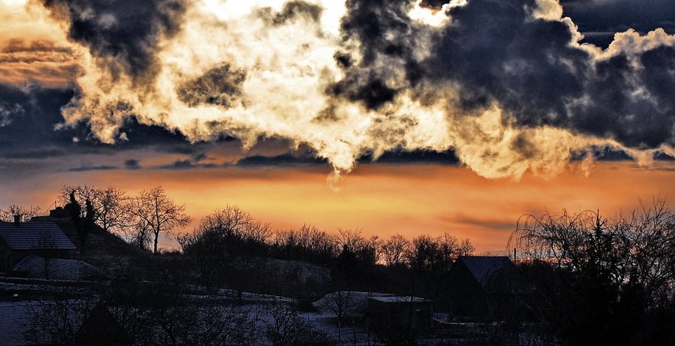 romantic sunset and clouds over the village