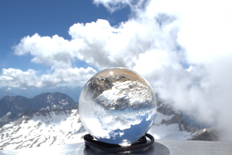 glass ball on top of a glacier