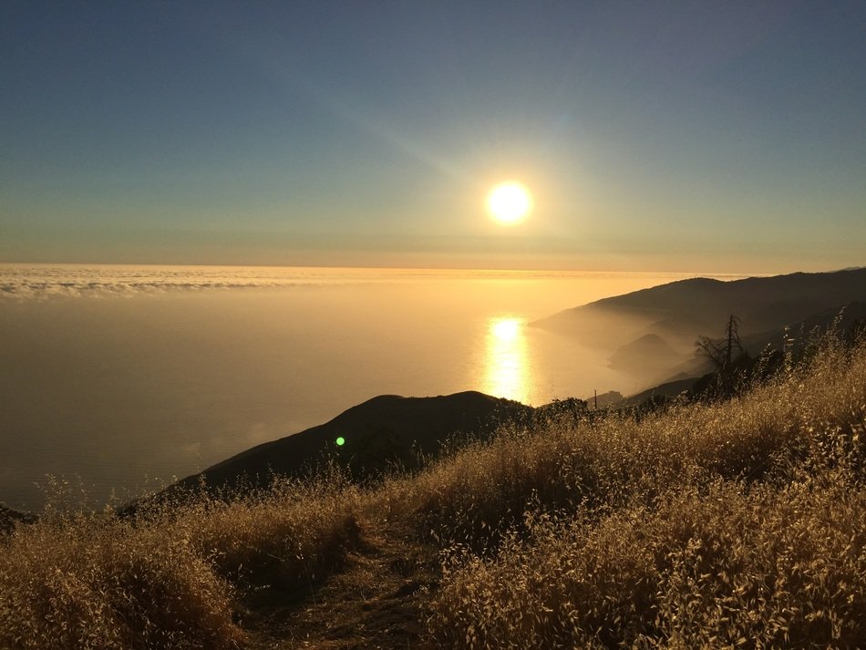 sunset over the cliffs on the coast