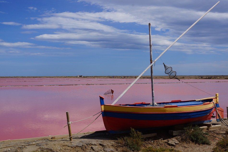 multi-colored fishing boat on the coast of France