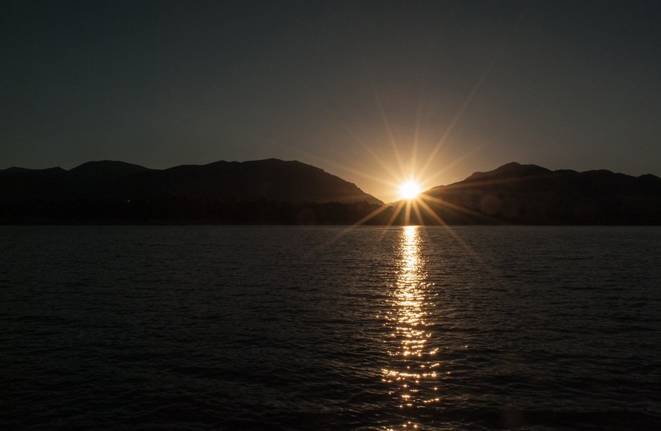 sunrise over the mountains above the lake