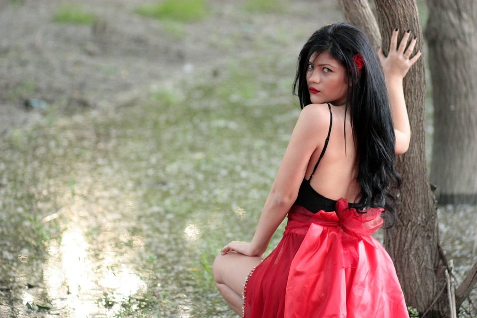 model with black hair in the forest