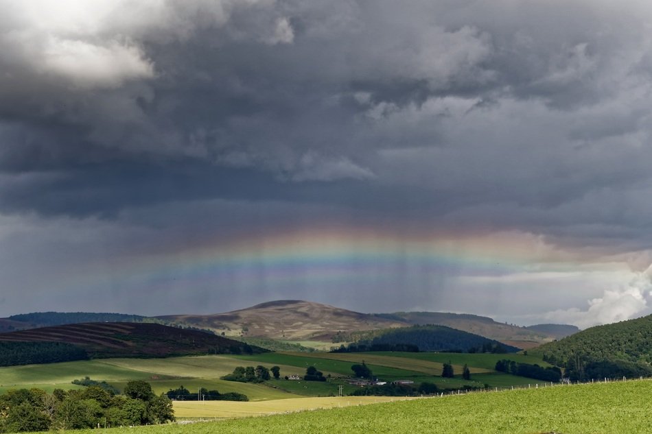 rainbow in the clouds over scotland