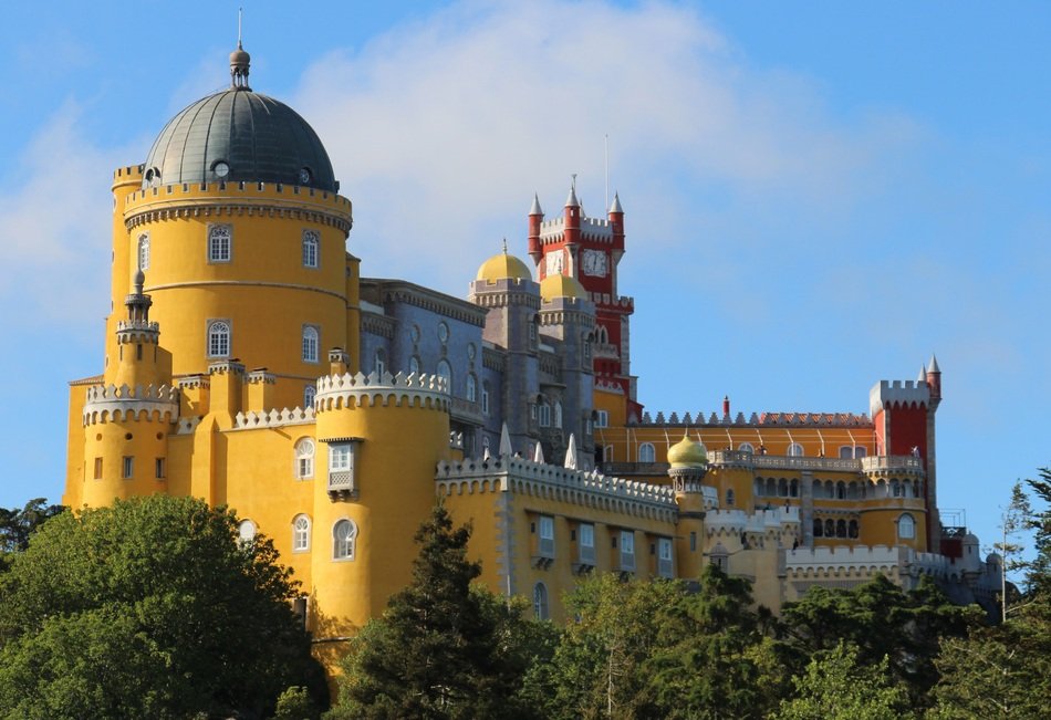 palace behind green trees