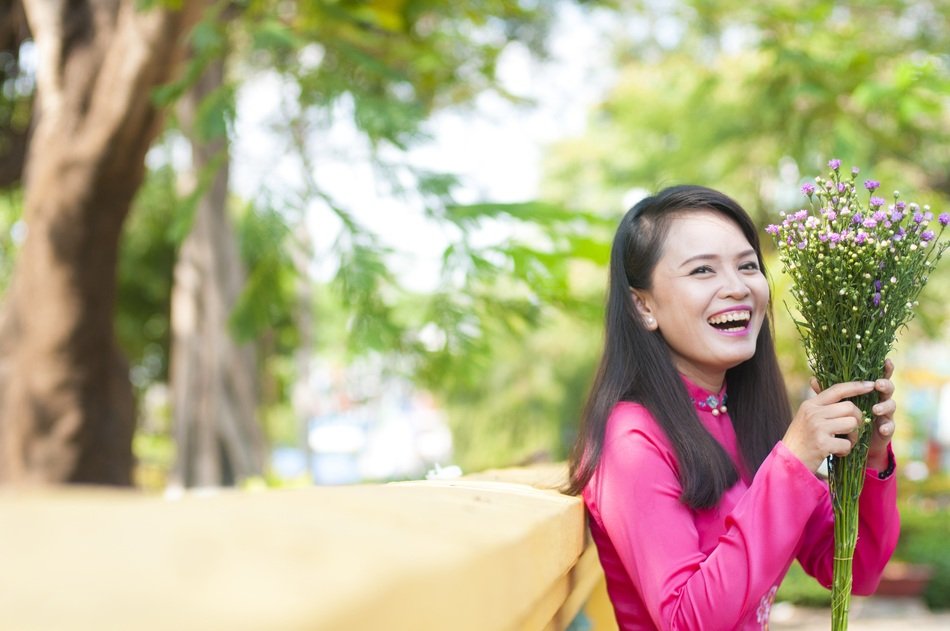 Vietnamese woman with flower bouquet