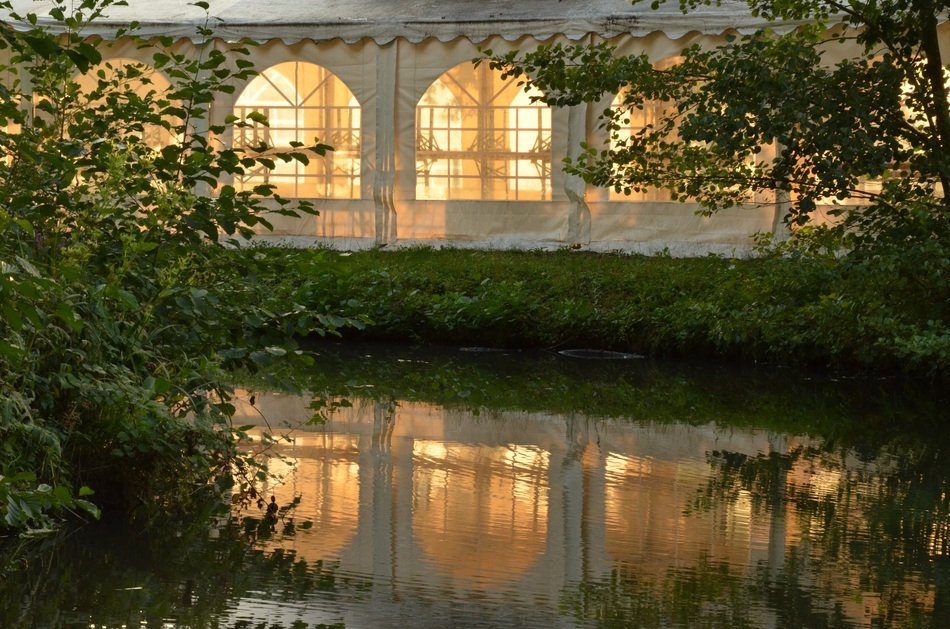 tent with windows near the reservoir