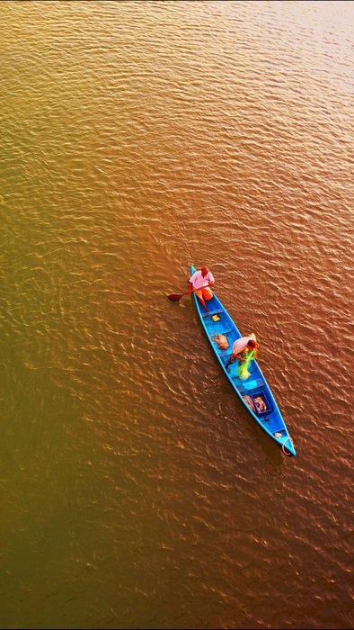 two Fishermen in blue Boat, top view