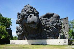 large stone sculpture in a park in bali