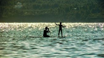 people on Paddle boards in summer