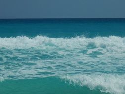 white waves on the blue sea
