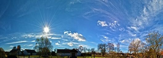 Panorama view of farm and blue cloudy sky at sunny day