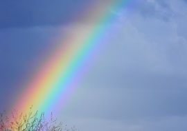 Rainbow at cloudy sky after Storm