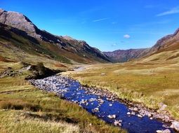 stream in a valley near the mountain