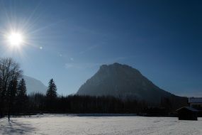 bright sun over picturesque winter alpine landscape