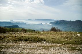 panorama of a valley in the clouds in the mountains of italy