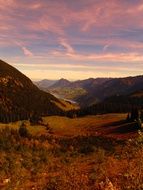 pink sky in mountains in the evening