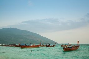 traditional boats off the coast of thailand